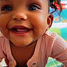 Alora is registered to the contest to win money with this photo: baby, child, closeup, colorful_background, crawling, cute, earrings, eyes, face, hair, happy, indoor, infant, mouth, patterned_fabric, person, pink_clothing, playful, portrait, smiling