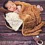Jayden participe au concours pour gagner de l'argent avec cette photo : baby, newborn, sleeping, blanket, knitted, basket, wooden_floor, toy, crocheted, bear, cozy, infant, wrapped, peaceful, cute, soft, portrait, indoors, resting, handmade