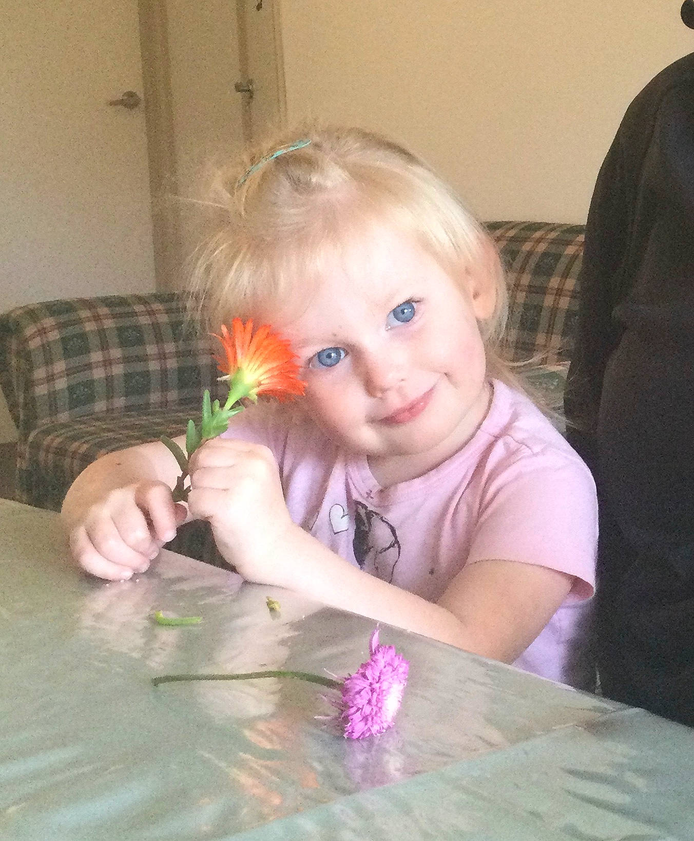 Aloy joined the competition — help win amazing prizes! child, event, finger, flooring, flower, fun, happy, head, iris, joy, nail, person, petal, pink, plant, sitting, skin, smile, table, thumb