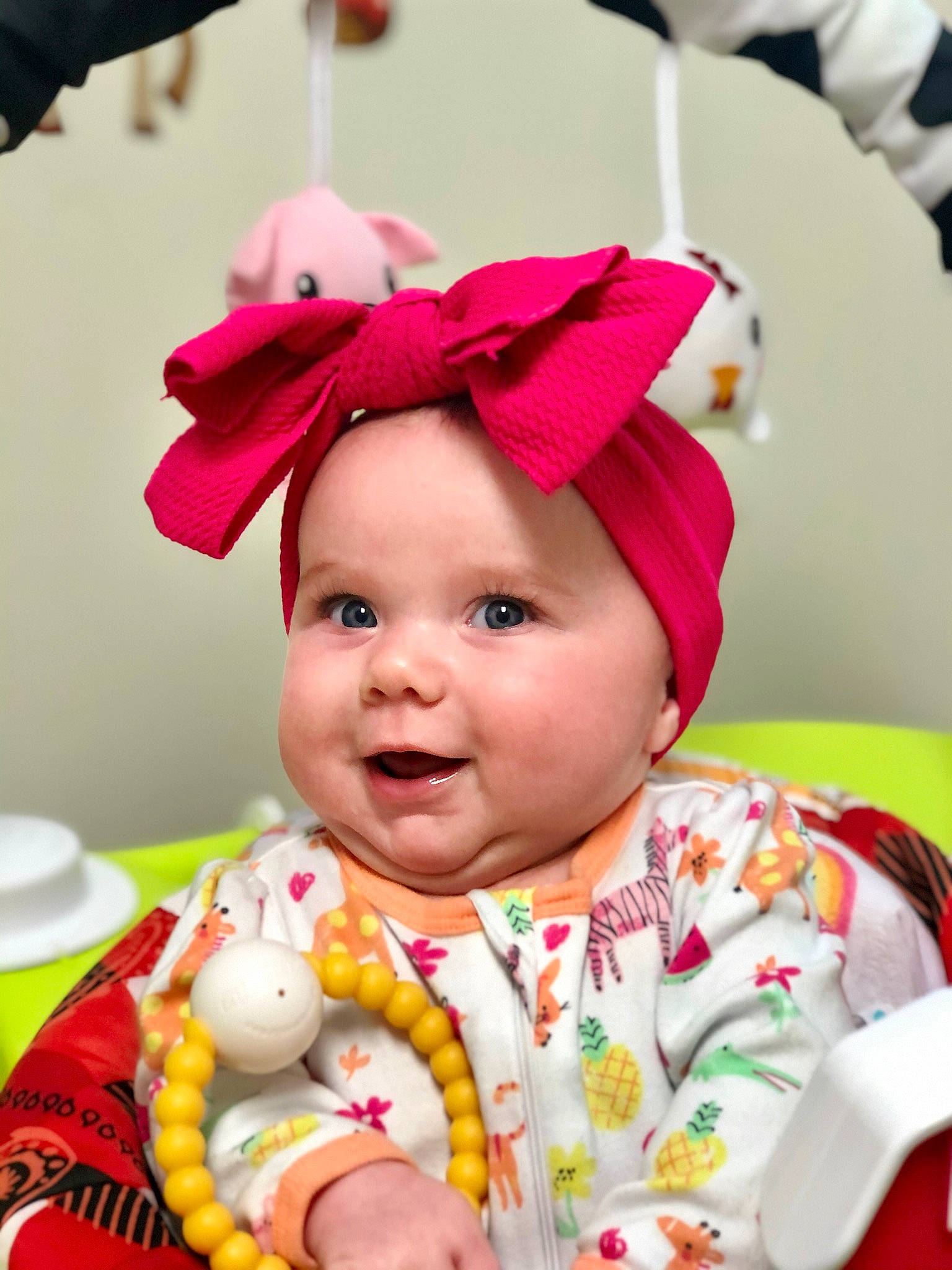 Stephanie joined the competition — help win amazing prizes! baby, baby_toddler_clothing, cheek, child, dress, face, facial_expression, fun, green, happy, head, headgear, headwear, person, pink, red, skin, sleeve, smile, textile