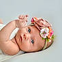 Everley joined the competition — help win amazing prizes! baby, infant, portrait, headband, flower, blue_eyes, skin, cute, soft_light, closeup, newborn, child, lying_down, hand, expression, pastel_colors, head, face, adorable, innocent