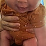 Everley is registered to the contest to win money with this photo: baby, child, infant, close_up, face, eyes, smile, hands, holding, polka_dot, clothing, person, skin, arm, leg, foot, indoor, cute, expression, portrait