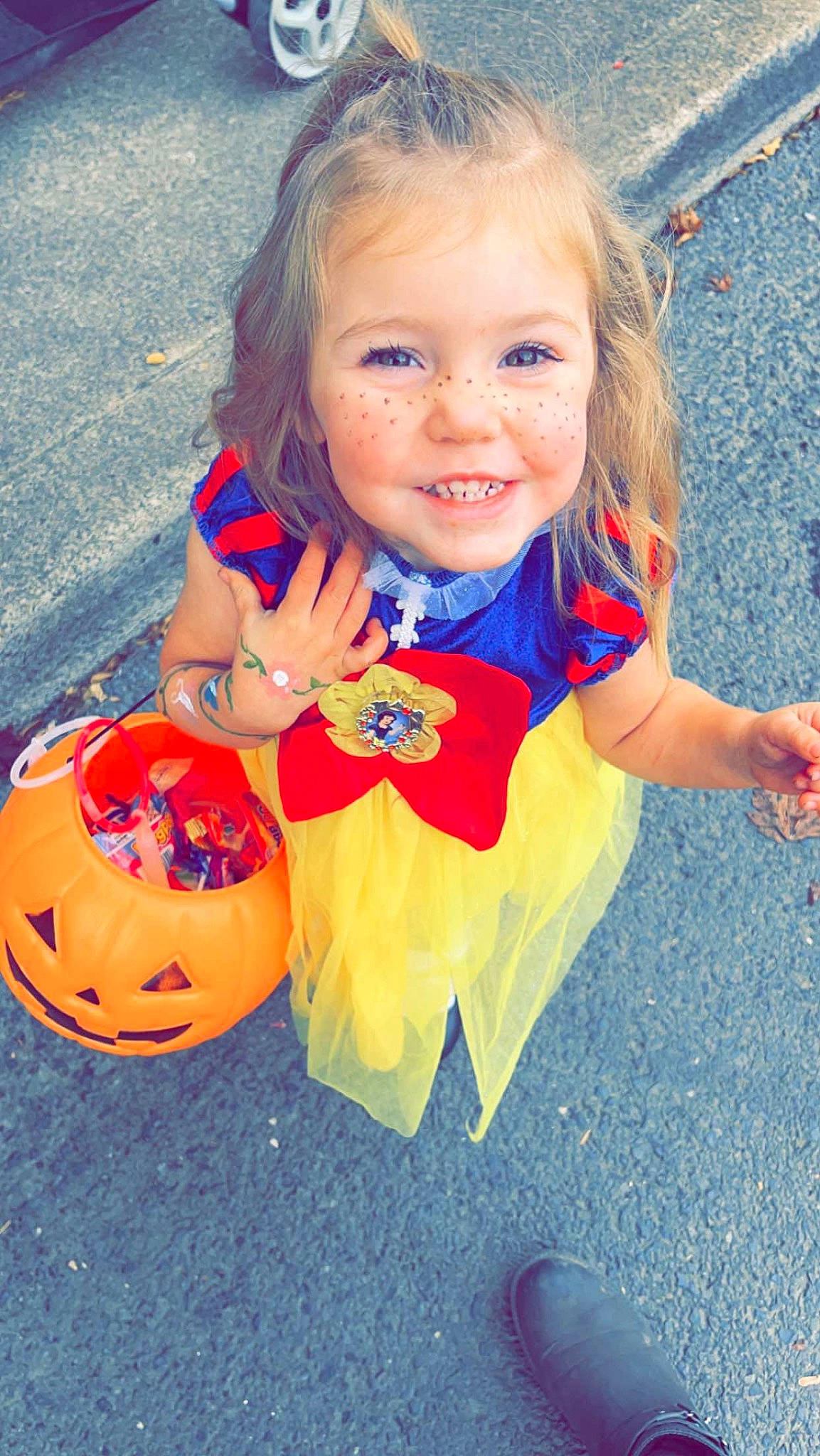 Indie is registered to the contest to win money with this photo: baby_toddler_clothing, ball, blond, blue, child, electric_blue, face, football, fun, gesture, grass, happy, head, joy, leisure, orange, people_in_nature, person, recreation, smile