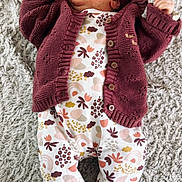 Maya participe au concours pour gagner de l'argent avec cette photo : baby, beanie, bodypart, bonnet, cap, clothing, face, finger, hand, hat, head, hoodie, hosiery, knitwear, pants, person, purple, sock, sweater, sweatshirt
