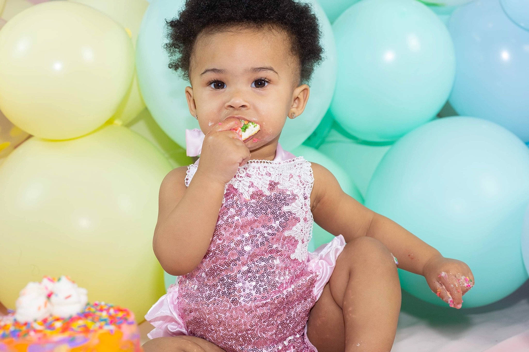 Honesty is registered to the contest to win money with this photo: arm, baby_toddler_clothing, balloon, beauty, child, dress, facial_expression, fun, hair, hand, happy, leisure, organ, party_supply, person, photograph, pink, skin, toddler, white