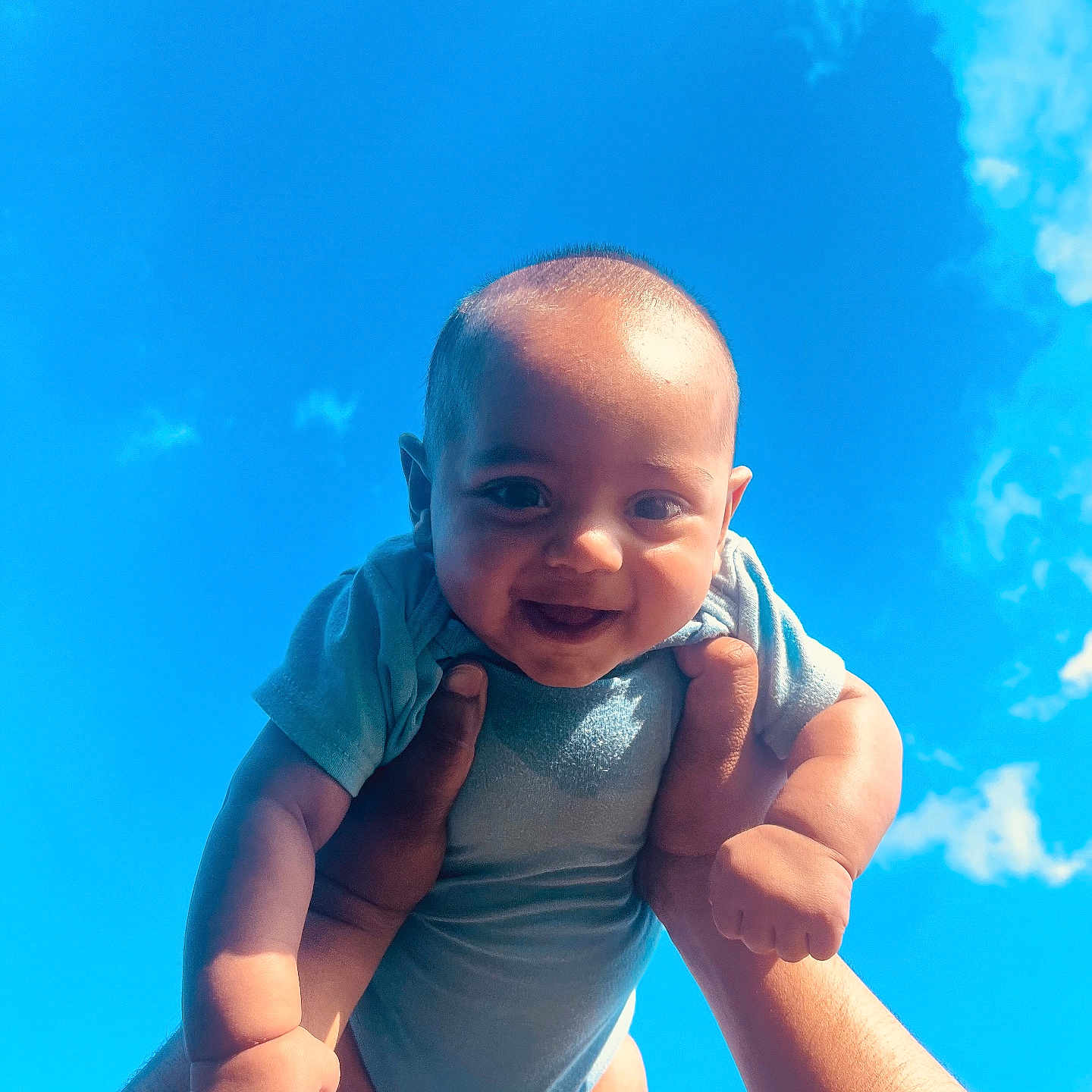 Ali Xavian joined the competition — help win amazing prizes! arms, baby, blue_sky, child, clouds, cute, face, fingers, hands, happy, head, infant, joy, onesie, outdoor, person, portrait, skin, smiling, sunlight