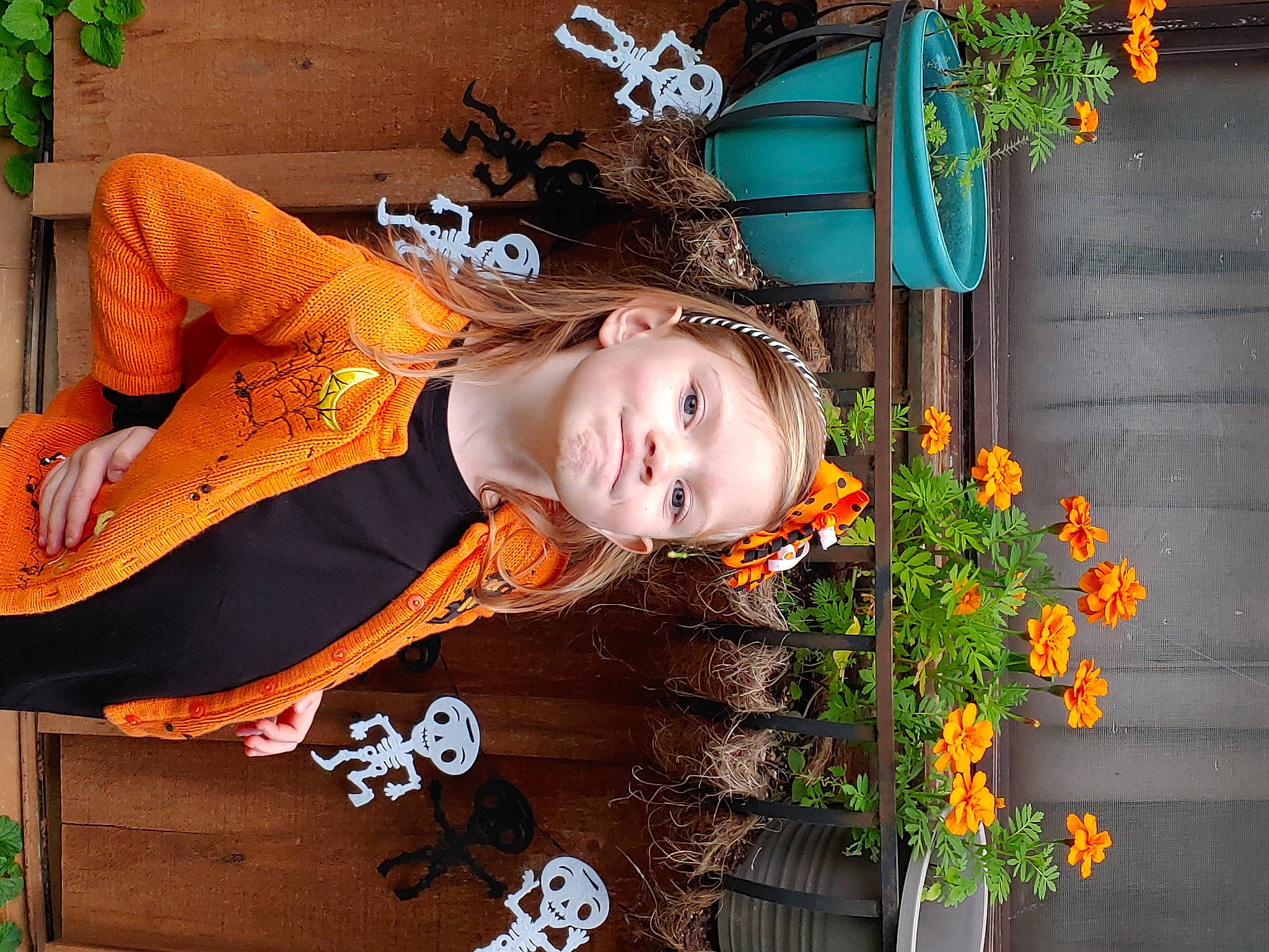 Lyla joined the competition — help win amazing prizes! annual_plant, beauty, child, floral_design, floristry, flower, flower_arranging, fun, grass, green, happy, joy, leaf, orange, pattern, person, plant, portrait_photography, smile, spring