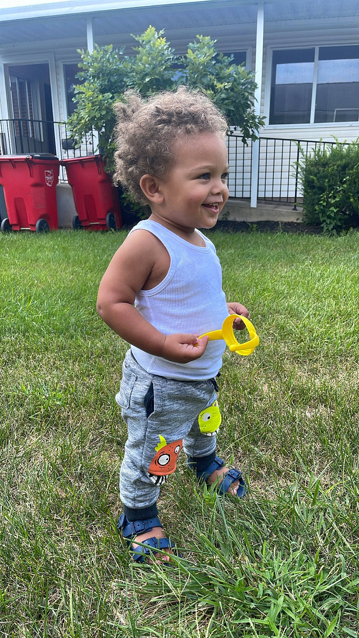Kamari joined the competition — help win amazing prizes! baby_toddler_clothing, child, fun, garden, grass, groundcover, happy, joy, lawn, leisure, people_in_nature, person, plant, recreation, shorts, smile, summer, t_shirt, toddler, waste_container