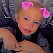 Arthur is registered to the contest to win money with this photo: child, car_seat, face, blue_eyes, pink_ears_filter, hands, seatbelt, car_interior, tshirt, blond_hair, cute, portrait, young_child, smile, digital_filter, car_window, seat, casual_clothing, indoors, baby
