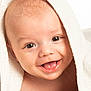baby, towel, face, tongue, smile, happy, child, skin, head, closeup, infant, cute, expression, portrait, person, eyes, mouth, soft, blanket, playful