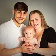 Jaxson joined the competition — help win amazing prizes! baby, child, couple, family, smile, portrait, people, happy, indoor, young_adult, holding, casual_clothing, love, togetherness, studio, light_skin, short_hair, long_hair, male, female