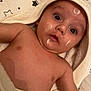 baby, infant, towel, hooded_towel, star_pattern, pillow, face, eyes, cream, lotion, skin, cheeks, chest, arm, lying_down, surprised, bath_time, nursery, cute, portrait