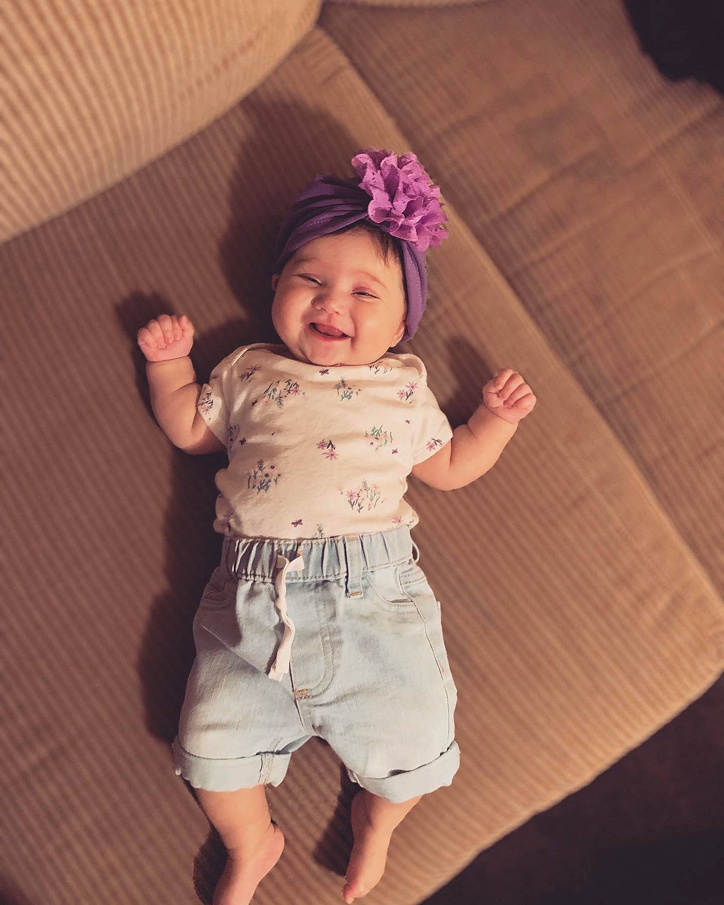 Elliana joined the competition — help win amazing prizes! abdomen, baby, baby_toddler_clothing, chin, eye, flash_photography, gesture, happy, head, headwear, human_body, person, pink, shorts, shoulder, skin, sleeve, smile, thigh, toddler