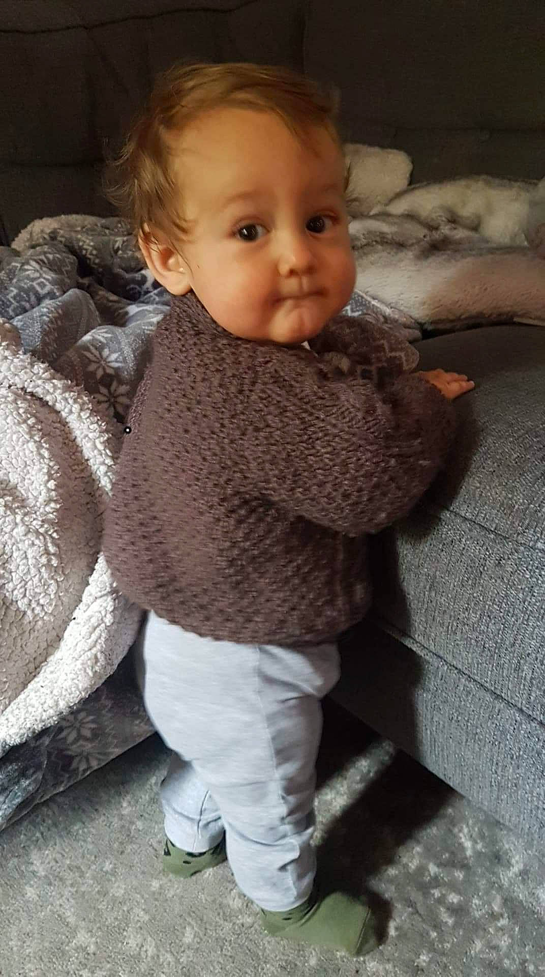 Oliver-james is registered to the contest to win money with this photo: arm, baby, baby_toddler_clothing, cheek, child, comfort, eye, face, fur, hairstyle, head, iris, lip, nose, organ, person, skin, sleeve, toddler, wool