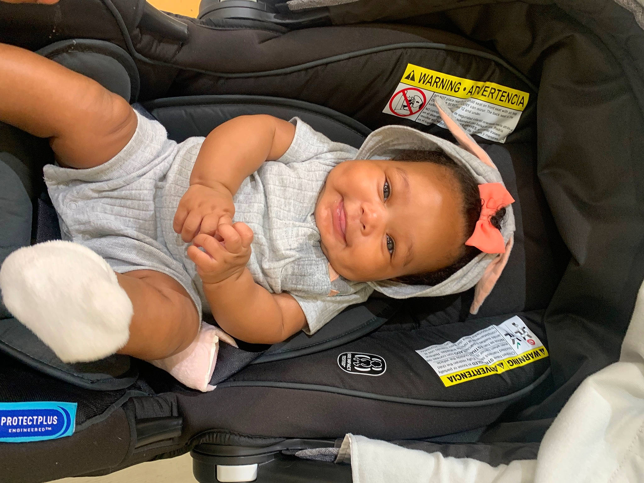 Kali joined the competition — help win amazing prizes! baby, baby_carriage, baby_in_car_seat, baby_products, baby_safety, baby_toddler_clothing, bag, car_seat, carmine, child, comfort, hat, human_leg, knee, lap, person, personal_protective_equipment, shorts, sitting, thigh