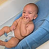 Ezekiel joined the competition — help win amazing prizes! baby, infant, child, smiling, happy, portrait, sitting, blue_seat, diaper, barefoot, hand, fingers, indoor, home, close_up, relaxed, playful, facial_expression, baby_chair, photography