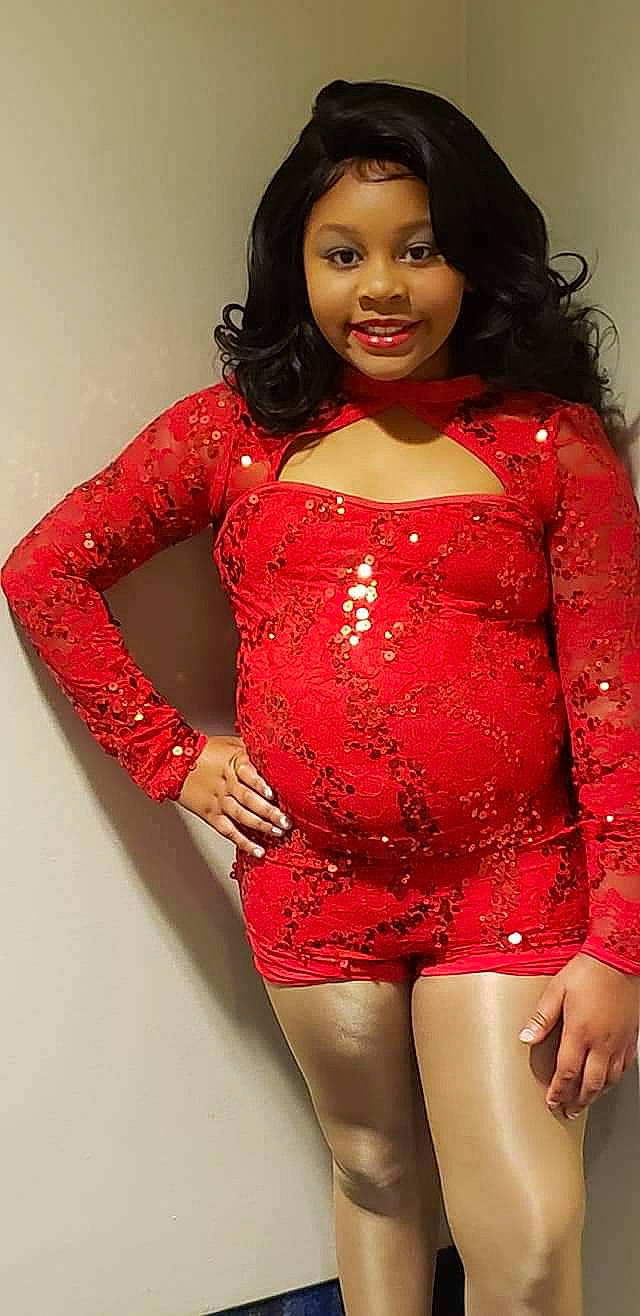 Na'Miyah joined the competition — help win amazing prizes! abdomen, black_hair, clothing, cocktail_dress, fashion_model, joy, leg, lip, long_hair, makeover, model, neck, person, photo_shoot, red, sleeve, thigh, trunk