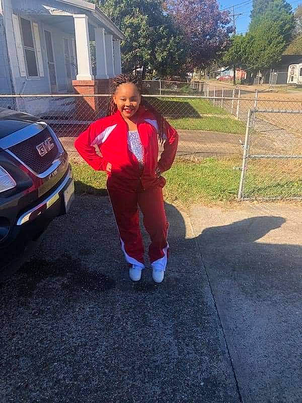 Na'Miyah is registered to the contest to win money with this photo: asphalt, car, family_car, joy, luxury_vehicle, minivan, person, plant, red, vehicle, vehicle_door