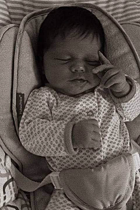 Meelah Xolo is registered to the contest to win money with this photo: arm, baby, baby_toddler_clothing, black_and_white, cheek, comfort, eye, hairstyle, headgear, iris, lip, mouth, nose, organ, outerwear, person, product, skin, style, textile