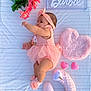 Estefany joined the competition — help win amazing prizes! baby, pink, tutu, headband, flower, blanket, toy, heart, soft_toy, striped, infant, cute, lying_down, child, decor, stuffed_animal, pastel_colors, nursery, playful, portrait