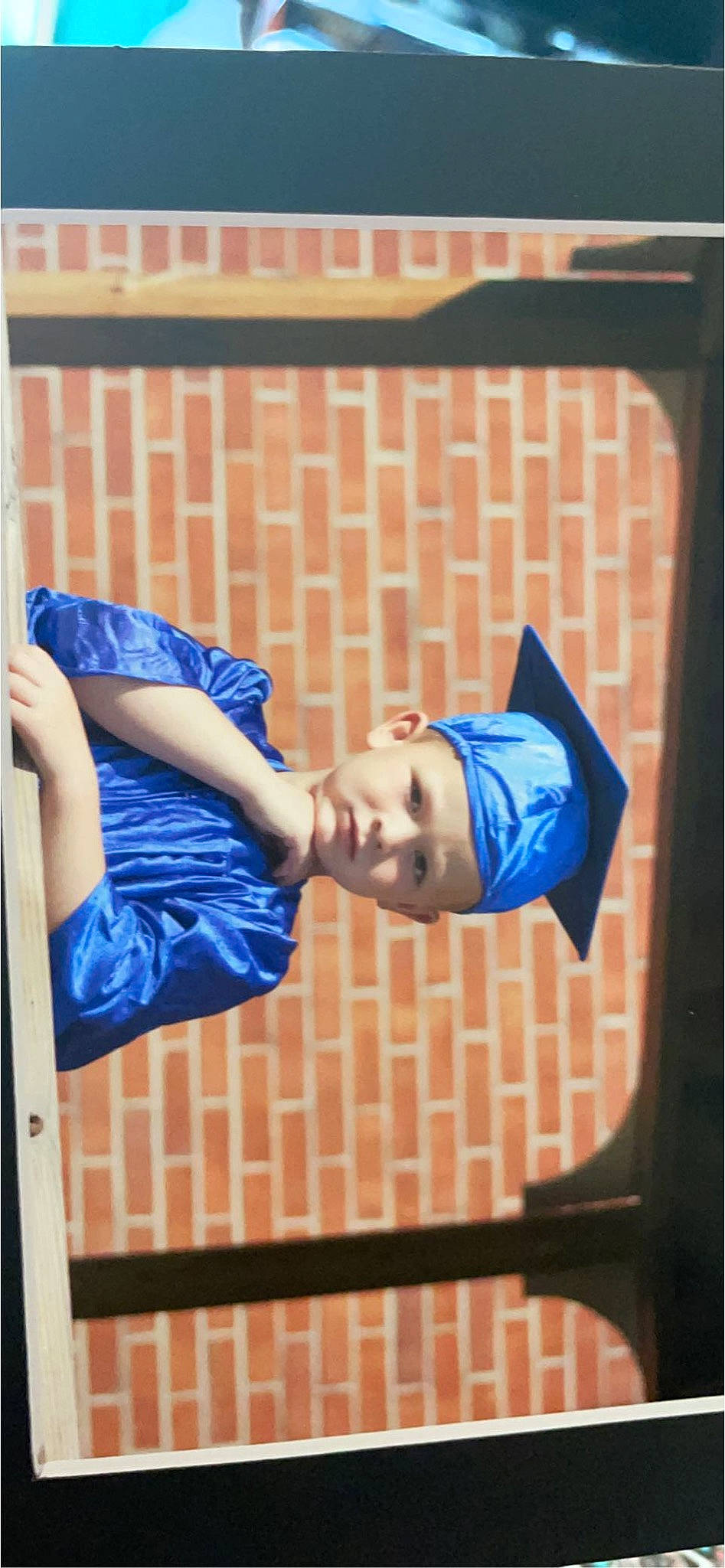 Gabriel is registered to the contest to win money with this photo: brick, brickwork, child, denim, elbow, electric_blue, fun, happy, hat, headwear, knee, leisure, orange, pattern, person, player, sitting, sleeve, sportswear, street_fashion