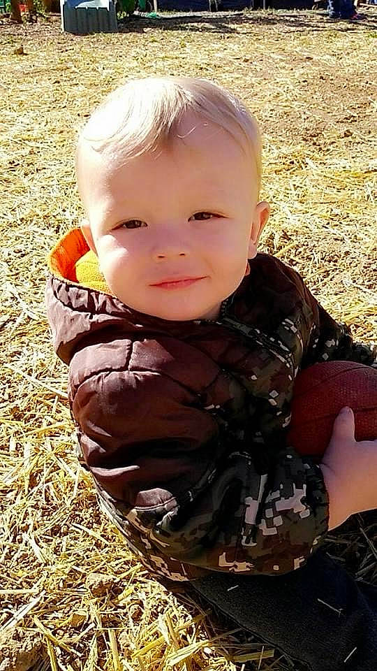 Gabriel joined the competition — help win amazing prizes! baby, baby_toddler_clothing, cheek, child, fun, grass, happy, head, iris, people_in_nature, person, plant, sitting, skin, smile, soil, sunlight, toddler, tree, vertebrate