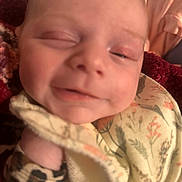 Summer joined the competition — help win amazing prizes! baby, close_up, smile, blanket, floral_pattern, leopard_print, infant, face, skin, comfort, soft, child, young, cute, cozy, sleepy, apparel, expression, indoors, portrait