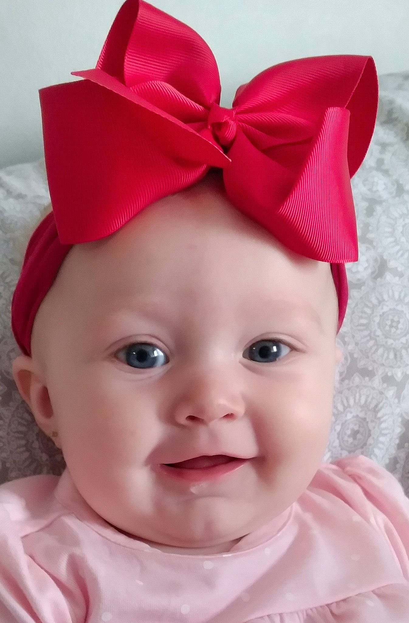 Khloe is registered to the contest to win money with this photo: baby, baby_toddler_clothing, cap, cheek, chin, costume_hat, face, hairstyle, head, headband, headgear, headpiece, headwear, lip, party_supply, person, pink, skin, smile, textile