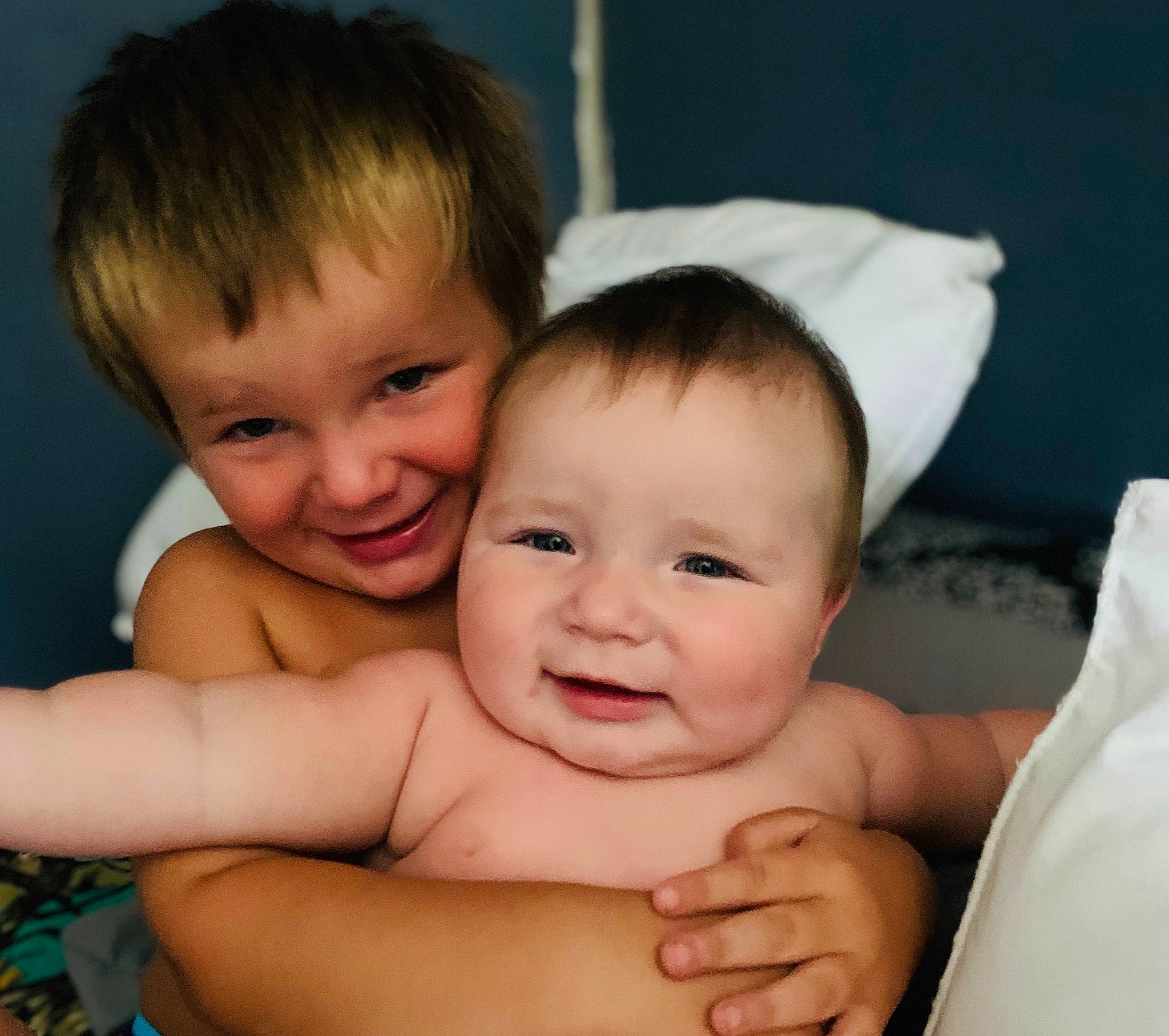 Elijah is registered to the contest to win money with this photo: baby, cheek, chest, chin, face, facial_expression, finger, gesture, hair, happy, head, iris, joy, muscle, nose, organ, person, product, skin, smile