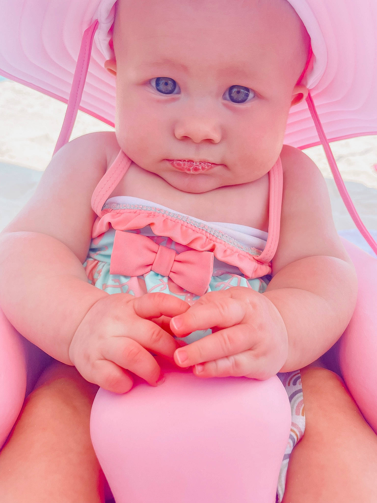 Weslynn joined the competition — help win amazing prizes! arm, baby, baby_toddler_clothing, cheek, eye, finger, gesture, hand, happy, headwear, human_body, joint, lip, mouth, muscle, neck, nose, person, pink, shoulder