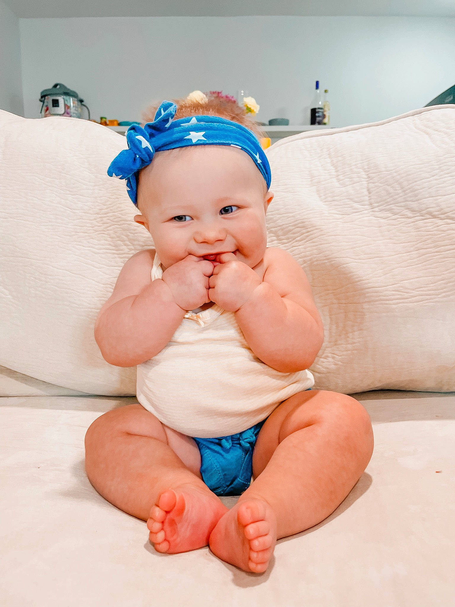 Weslynn is registered to the contest to win money with this photo: baby, baby_toddler_clothing, child, comfort, fashion_accessory, finger, foot, fun, happy, hat, headband, human_leg, knee, person, pink, skin, smile, stomach, thigh, thumb