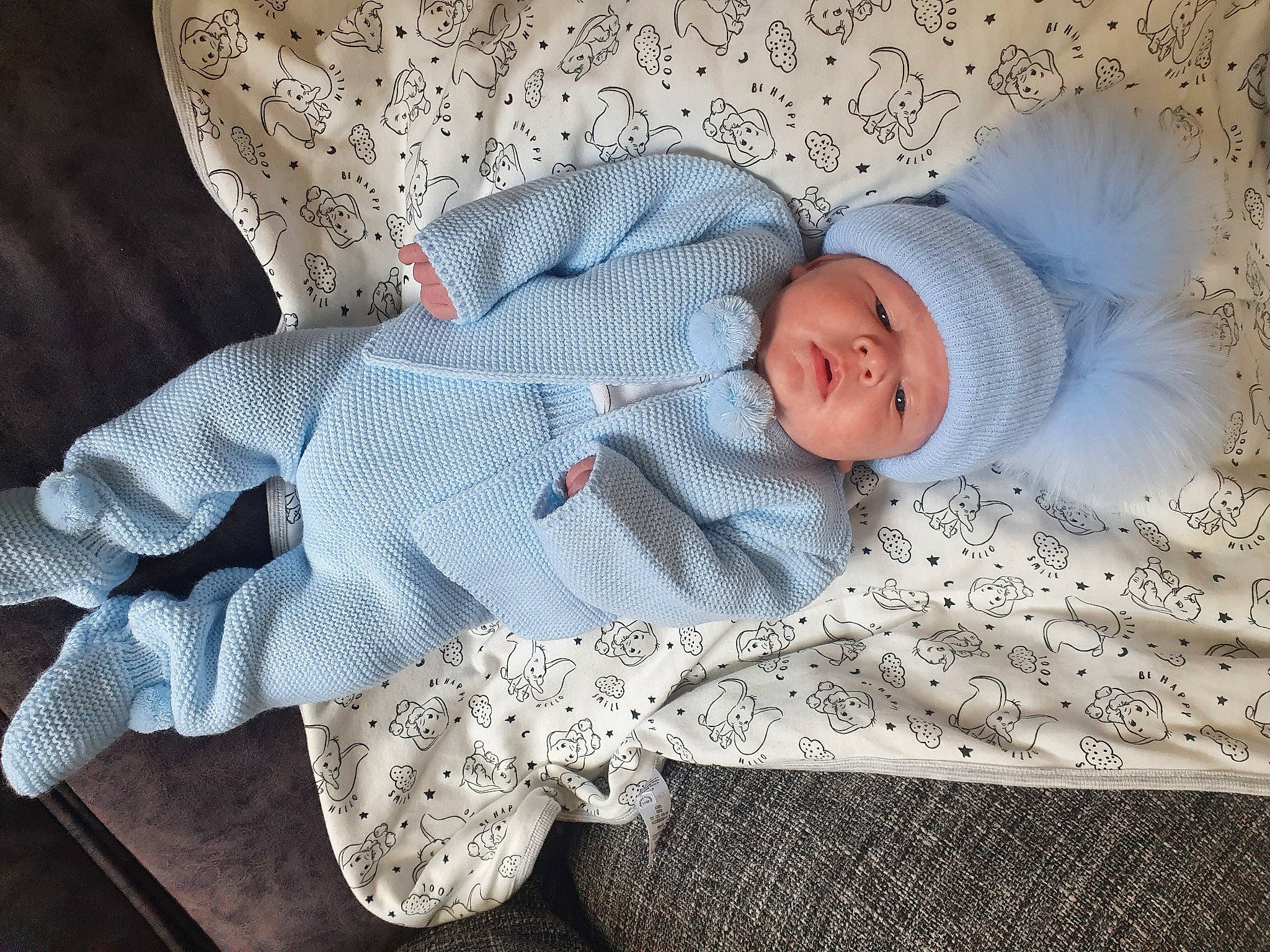 Naoh is registered to the contest to win money with this photo: arm, baby, baby_products, baby_sleeping, baby_toddler_clothing, carmine, child, comfort, eye, grey, hat, head, headwear, human_body, linens, pattern, person, product, room, sleeve