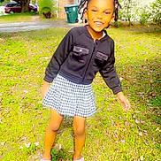 Zeezee is registered to the contest to win money with this photo: beads, braids, child, daylight, girl, grass, greenery, happy, house, jacket, nature, outdoor, playful, portrait, sandals, skirt, smile, summer, sunlight, tree