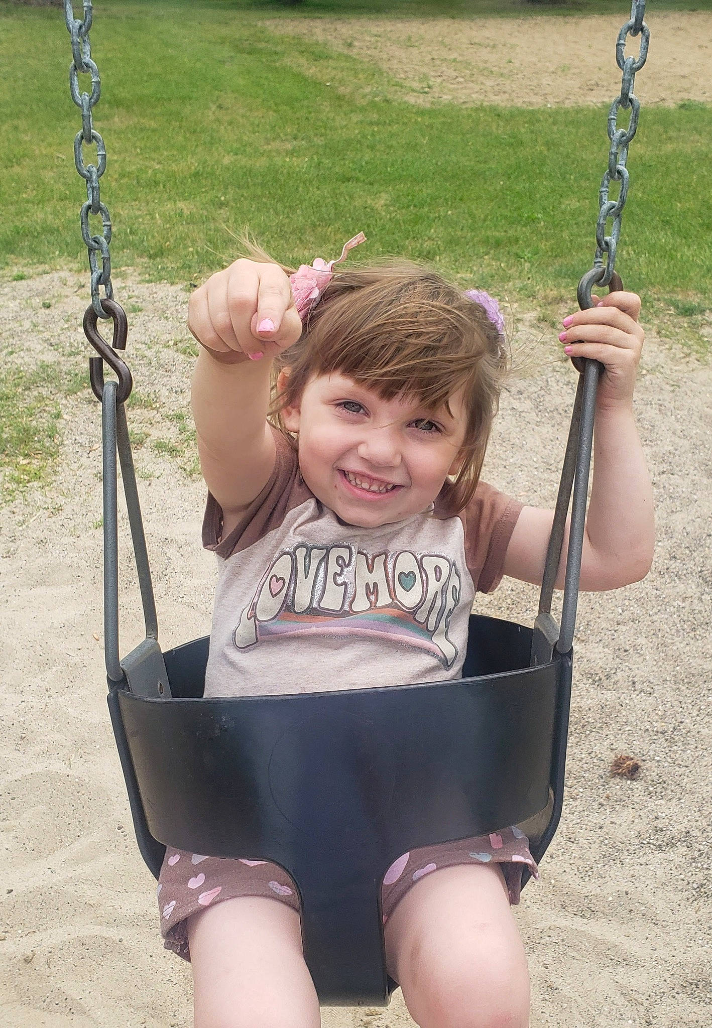 Jacqueline is registered to the contest to win money with this photo: black, eye, facial_expression, finger, fun, grass, hair, hand, happy, head, human, human_body, joy, leisure, mammal, person, photograph, product, smile, standing