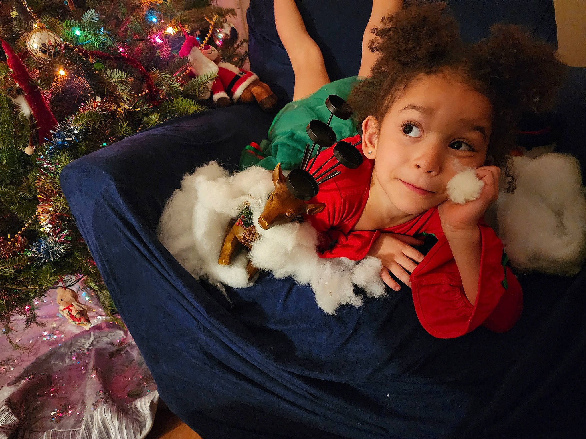 Arlia is registered to the contest to win money with this photo: christmas, christmas_decoration, christmas_eve, christmas_ornament, christmas_tree, companion_dog, conifer, event, fun, fur, happy, holiday, holiday_ornament, lap, ornament, person, santa_claus, sitting, stuffed_toy, toddler