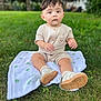 baby, child, infant, grass, outdoor, blanket, shoes, romper, greenery, nature, cute, portrait, sitting, young_child, footwear, expression, daylight, soft_texture, casual_clothing, curious