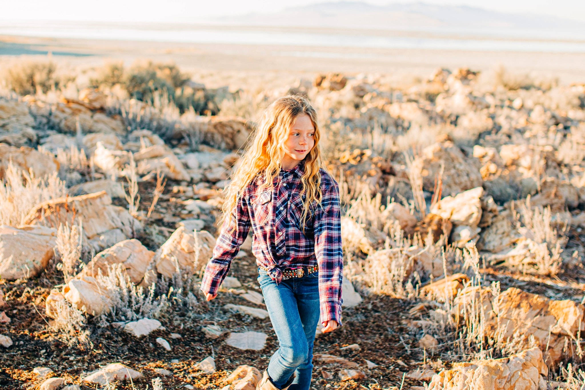 Natasha is registered to the contest to win money with this photo: brown_hair, child, cloud, denim, flash_photography, fun, grass, grass_family, grassland, happy, landscape, natural_environment, natural_landscape, people_in_nature, person, plaid, plant, prairie, sunlight, winter