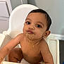 Vishruth joined the competition — help win amazing prizes! baby, high_chair, messy, food, cute, child, indoor, smiling, skin, face, feeding, infant, expression, hands, mouth, hair, earrings, diaper, table, room