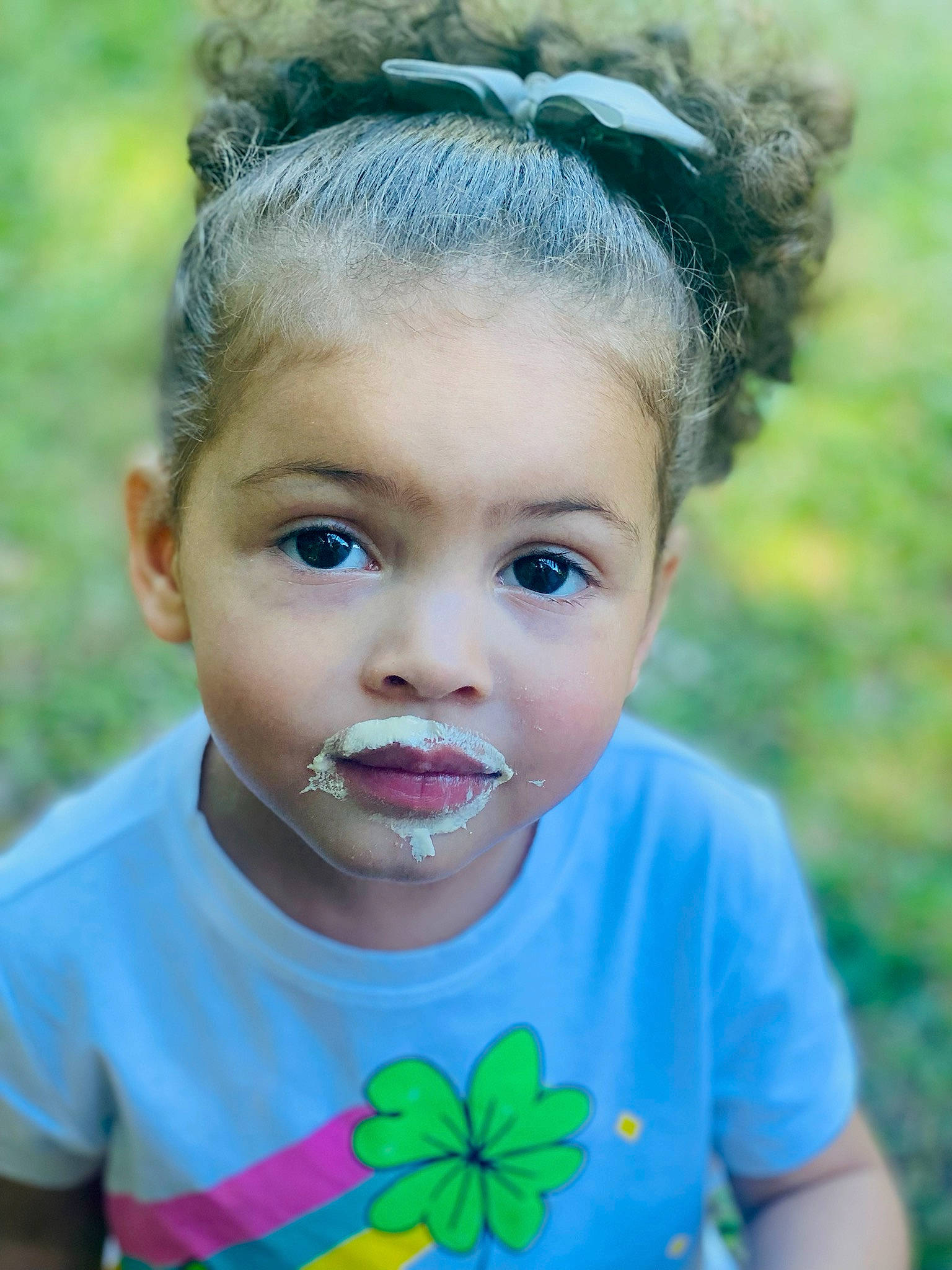 Marley joined the competition — help win amazing prizes! azure, baby_toddler_clothing, blue, child, clothing, cool, eyelash, face, facial_expression, grass, green, hairstyle, happy, headpiece, iris, light, people_in_nature, person, summer, t_shirt