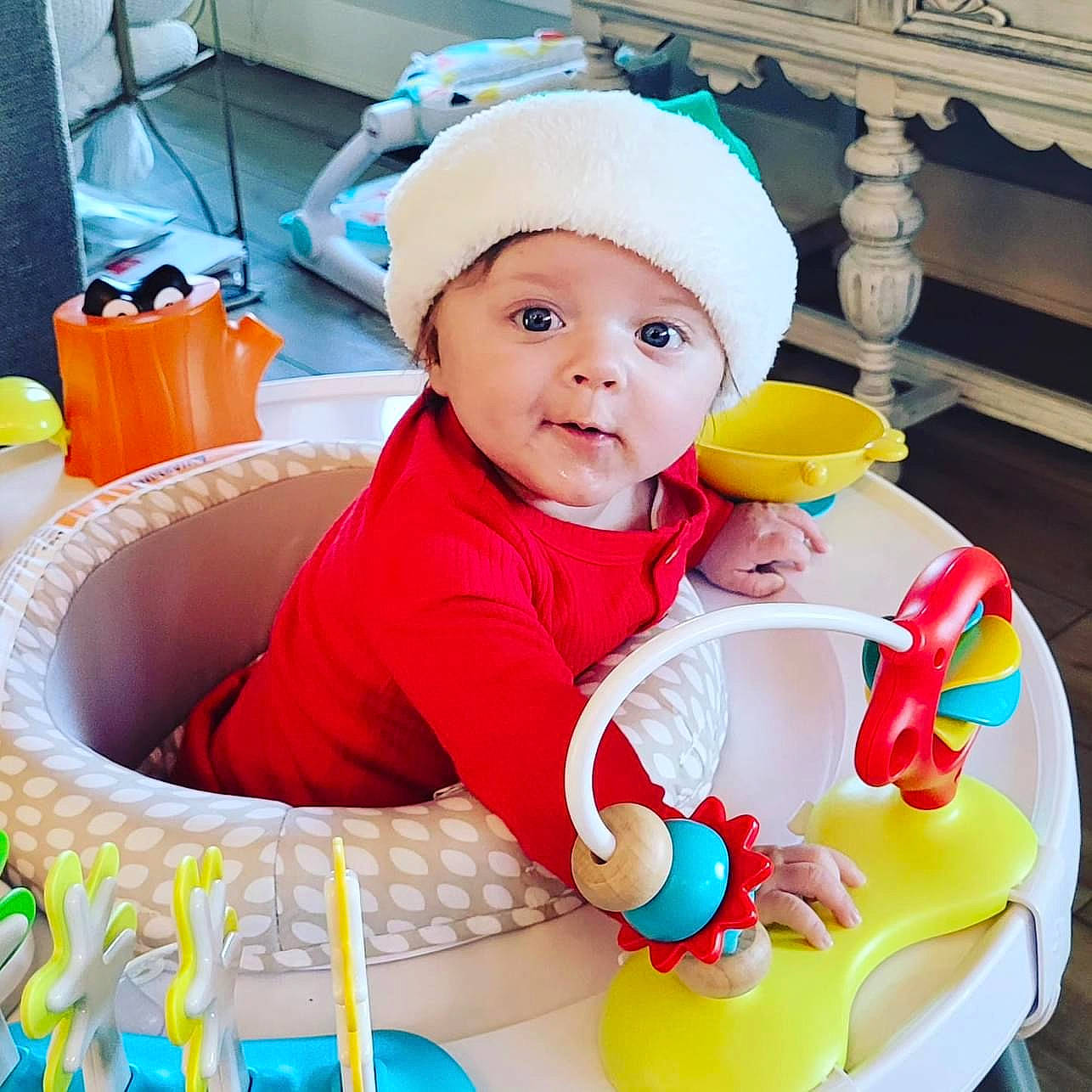 Reagan is registered to the contest to win money with this photo: baby, baby_playing_with_toys, baby_products, baby_safety, baby_toddler_clothing, baby_toys, cap, child, comfort, fun, happy, headgear, headwear, leisure, person, play, product, room, sitting, sleeve