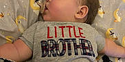 Braiden joined the competition — help win amazing prizes! baby, sleeping, pacifier, shirt, little_brother, blanket, bed, sheet, ghost, moon, halloween, child, face, arm, cute, indoors, resting, soft_lighting, toddler, clothing