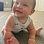 Braiden is registered to the contest to win money with this photo: baby, smiling, crawling, carpet, indoor, child, face, hand, foot, toes, cheeks, sleeveless_shirt, star_pattern, happy, natural_light, window, room, skin, infant, cute
