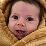 baby, infant, blanket, hood, towel, face, eyes, smile, portrait, close_up, soft_texture, wrapping, cozy, cute, skin, eyelashes, mouth, cheeks, warmth, swaddle