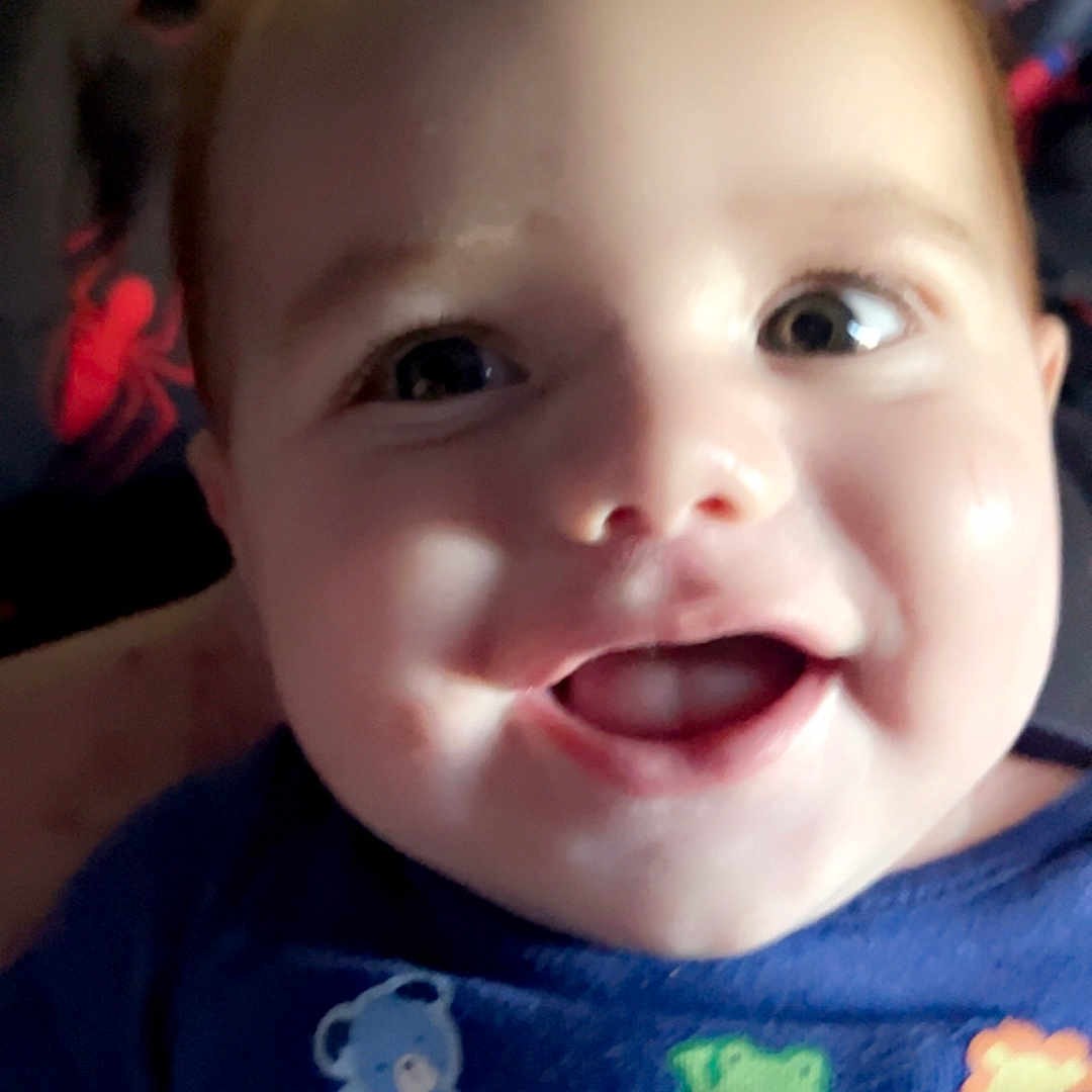 Declyn joined the competition — help win amazing prizes! animal_print, apparel, baby, blue_shirt, bright, cheerful, child, close_up, cute, face, happy, head, indoors, infant, pattern, person, portrait, skin, smiling, young_child