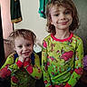 child, children, pajamas, green, grinch, smile, happy, indoor, clothing, person, cute, hair, holiday, festive, portrait, two_people, standing, young, family, room