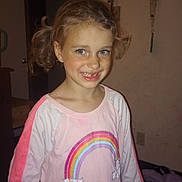Charlotte joined the competition — help win amazing prizes! child, girl, smile, indoor, pink_shirt, rainbow, cats, pigtails, curly_hair, happy, portrait, young, casual_clothing, face, person, cute, childhood, apparel, room, wall