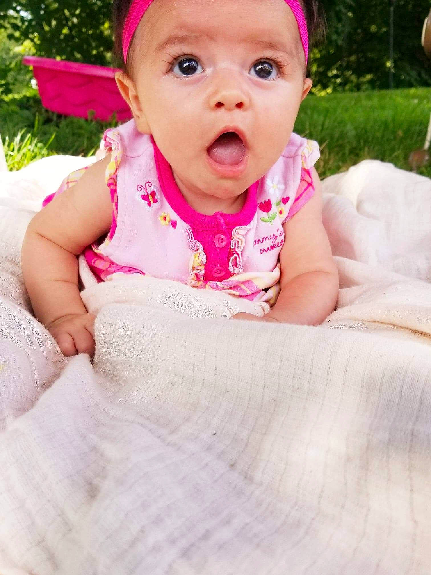 Faithlynn joined the competition — help win amazing prizes! baby, baby_toddler_clothing, beauty, cheek, child, eye, face, facial_expression, grass, hair_accessory, head, headgear, lip, mouth, nose, person, pink, plant, skin, smile