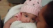 Camilla joined the competition — help win amazing prizes! affection, baby, blanket, bunny_hat, child, closeup, comfort, cozy, cuddle, cute, face, family, headwear, indoor, love, person, pink_hat, snuggle, soft, warm