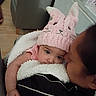 affection, baby, blanket, bunny_hat, child, closeup, comfort, cozy, cuddle, cute, face, family, headwear, indoor, love, person, pink_hat, snuggle, soft, warm