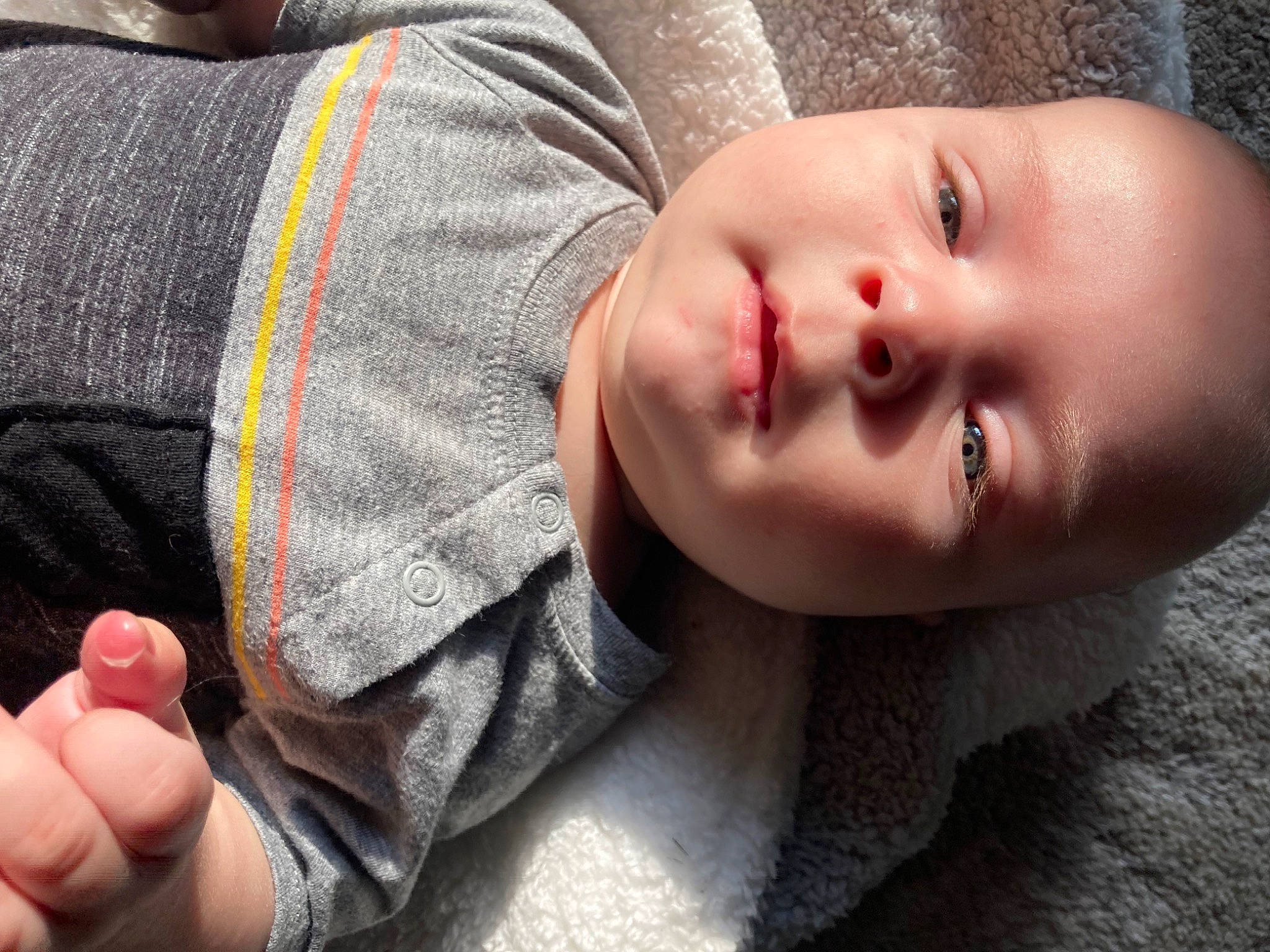 Kamden is registered to the contest to win money with this photo: baby, baby_toddler_clothing, cheek, child, comfort, eyelash, finger, gesture, happy, iris, lip, mouth, nail, neck, nose, person, plant, skin, sleeve, thumb